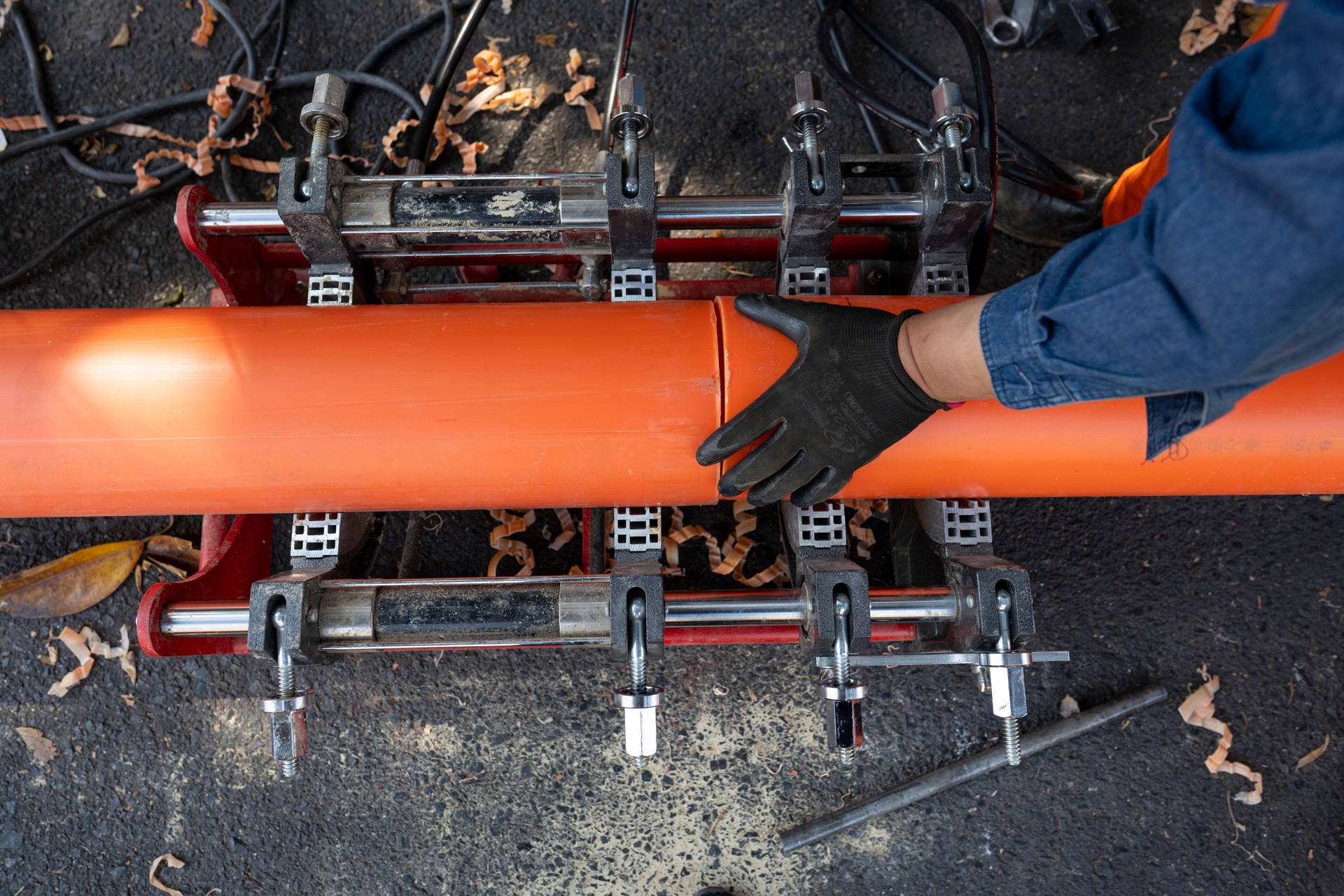 An engineering worker is repairing a pipeline